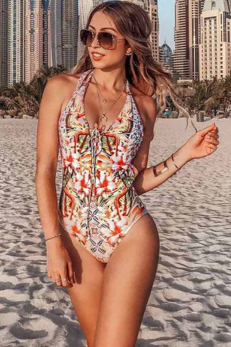 Woman Model with Wet Hair in a Red Swimsuit Poses in the Water in the Ocean  and Looks Out at the Horizon, Beautiful Tan Stock Photo - Image of beach,  bora: 263777088