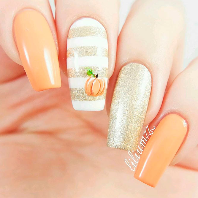 Elegant Nail Art With Gold Glitter And Tiny Pumpkin