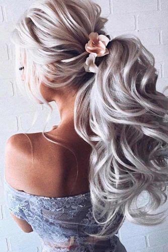 Wedding Ponytail With Flowers #flowershair #formalhairstyles #weddingponytails