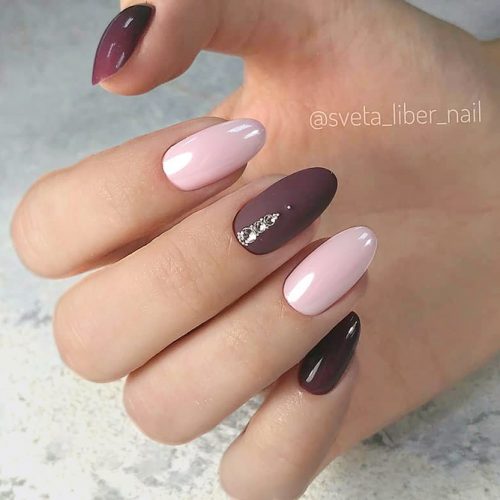 Delicate Manicure Ideas With Gorgeous Burgundy Accents For Homecoming Event #ovalnails #longnails #rhinestonesnails #nudenails #burgundynails