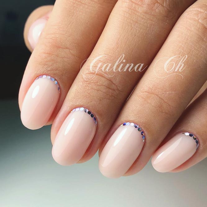 Delicate Manicure Ideas With Sequins Crescents For Homecoming Event #roundednails #shortnails #sequinsnails #nudenails #crescentnails