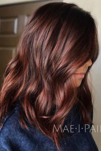 dark brown hair with red undertones