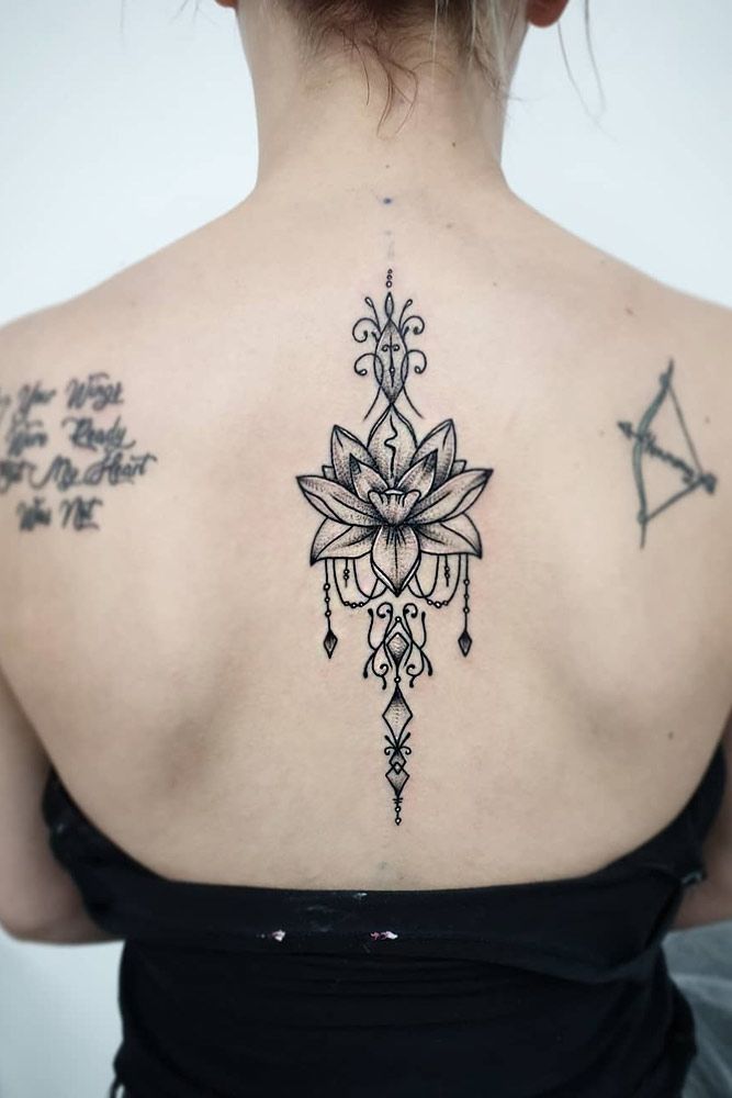 Geometrical lotus tattoo on back done at xpose tattoos jaipur