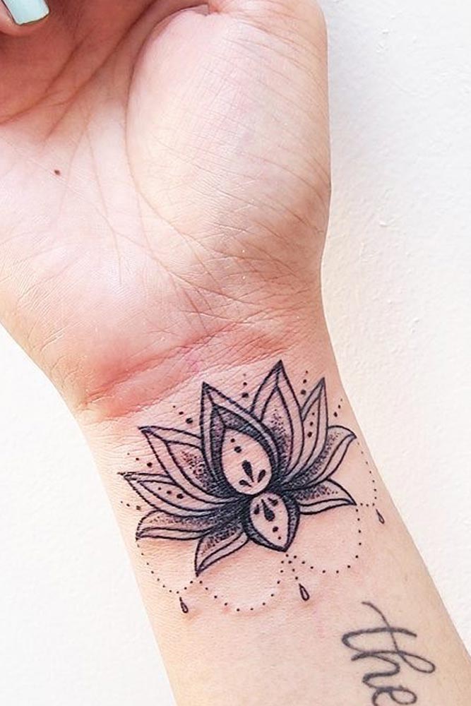 Beautiful Lotus Tattoo On A Wrist #wristtatto #blacktatto