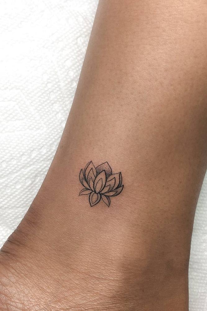 small lotus flower tattoo on foot