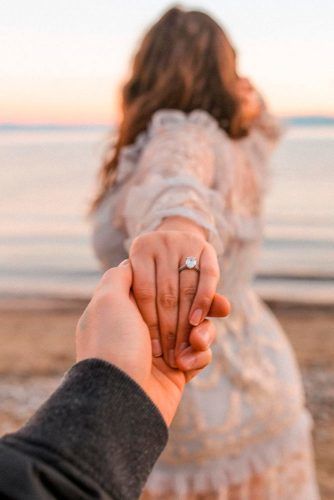 Photo of A unique engagement ring photo idea for couples