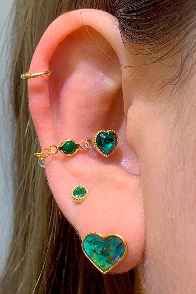 Conch Piercings With Green Stones #goldjewerly #conchpiercings