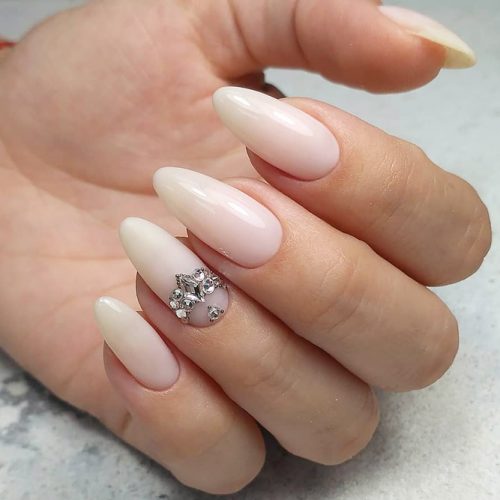 Beautiful Nude Almond Nails With Rhinestones #nudenails #almondnails #rhinestonesnails