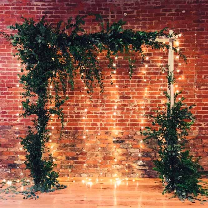 A Simple Idea With Greenery And Soft Lighting Backdrop #indoorarchway #simpleweddingarch