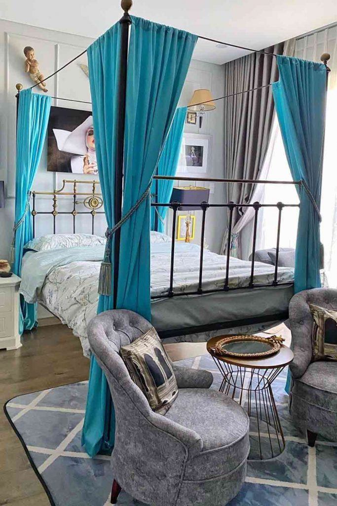 Metallic Vintage Canopy Bed With Blue Curtains #bluecurtains