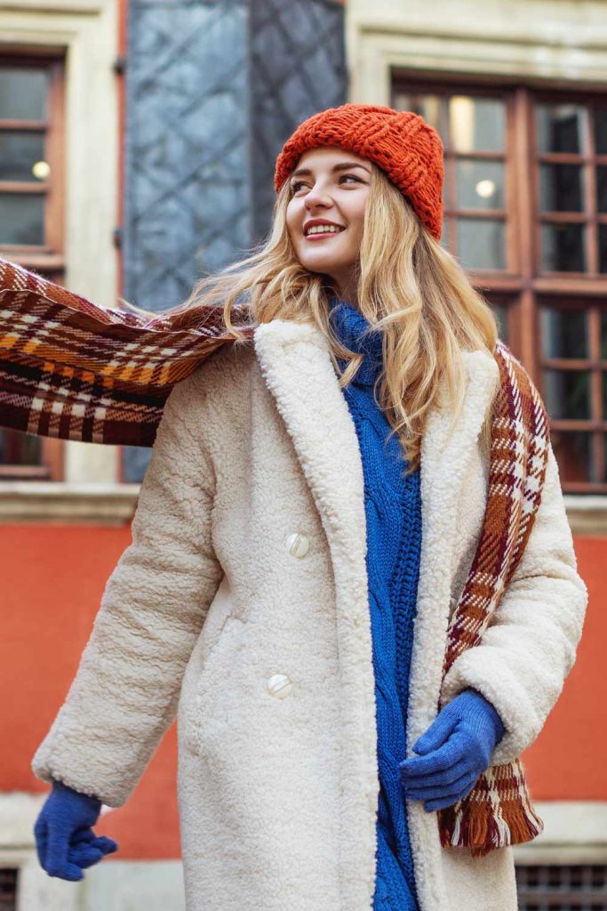 White Faux Fur Coat with Blue Sweater