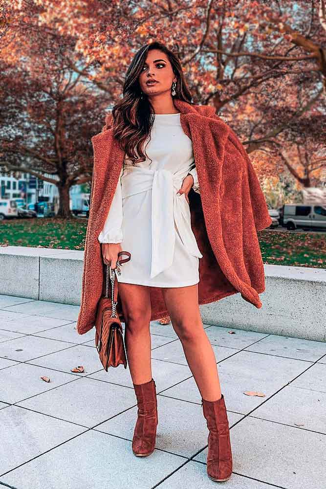 Red Outfit Accented With White Dress #redcoat #furcoat #whitedress