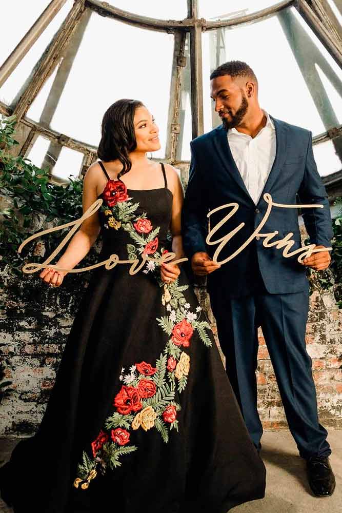 Black wedding dress sales with red roses