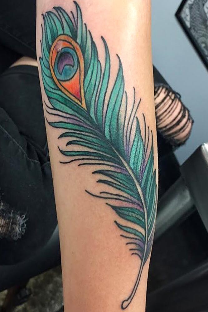 peacock feather tattoos on arm