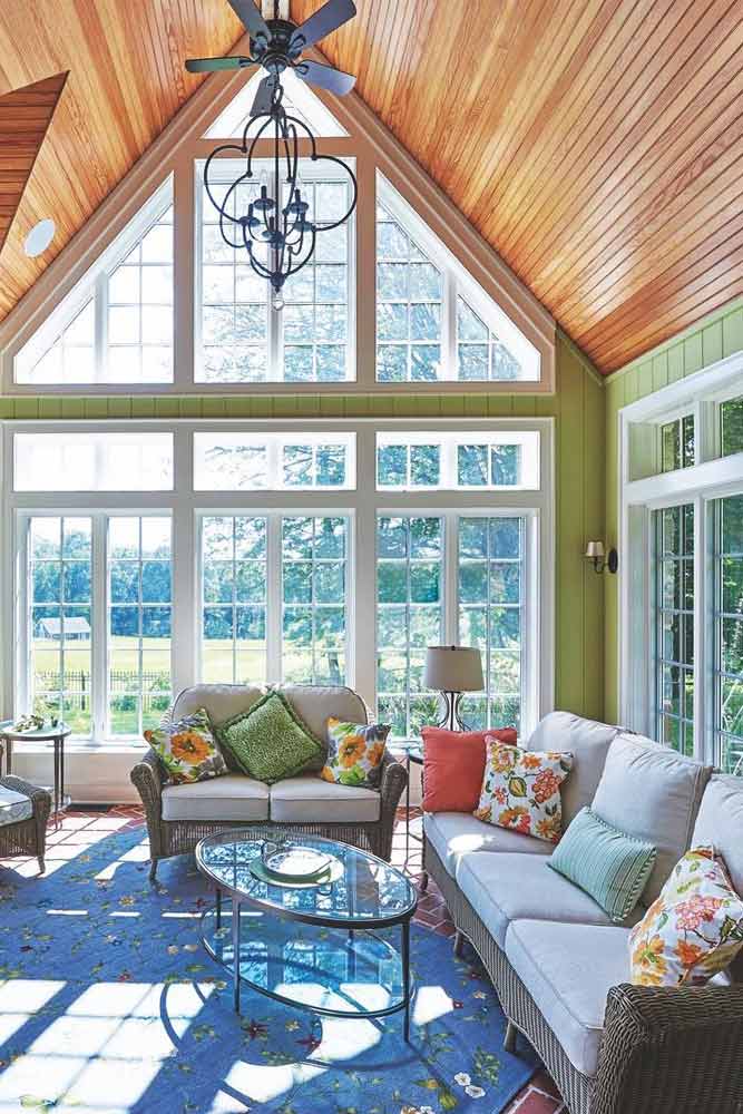 Sunroom With Dramatic Peaked Roof #wood #patternedpillows