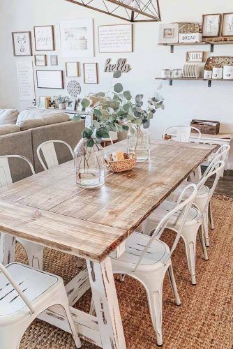 white farmhouse table with metal chairs