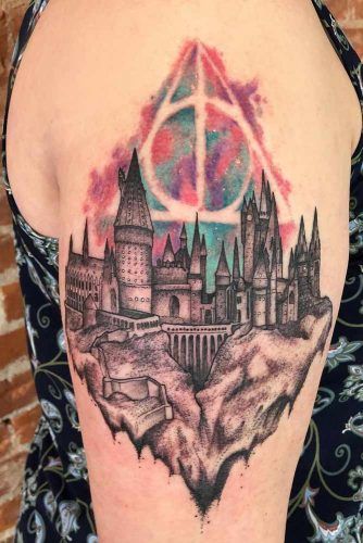 Black And White Hogwarts Tattoo With Watercolor Deathly Hallows Symbol #hogwartstattoo #hogwarts