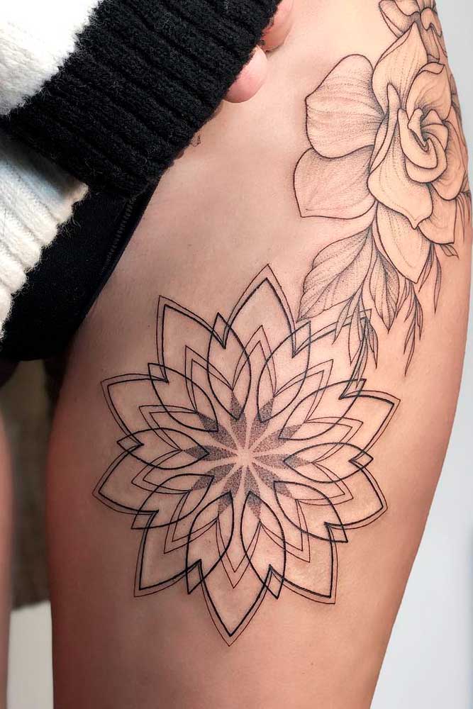 Un tatuaje de flor de mandala en el muslo #mandalatattoo