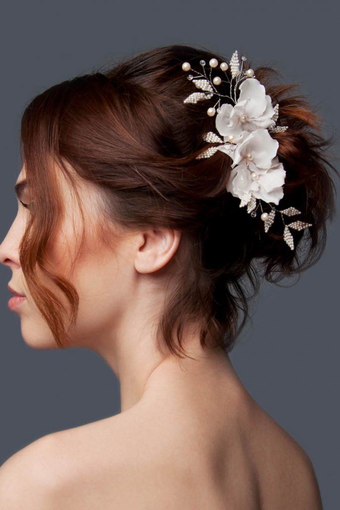 Updo Hairstyle with Floral Accessory