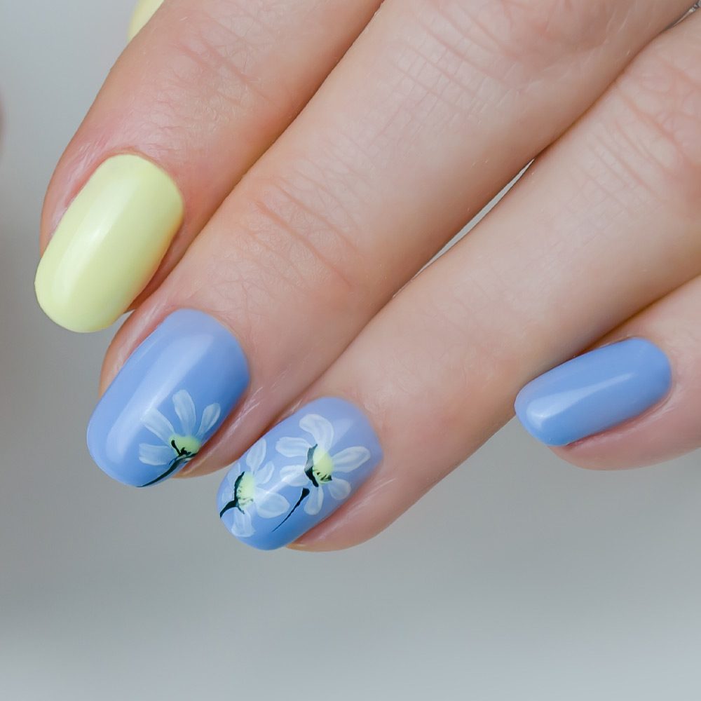 Pastel Blue Nails with Flowers