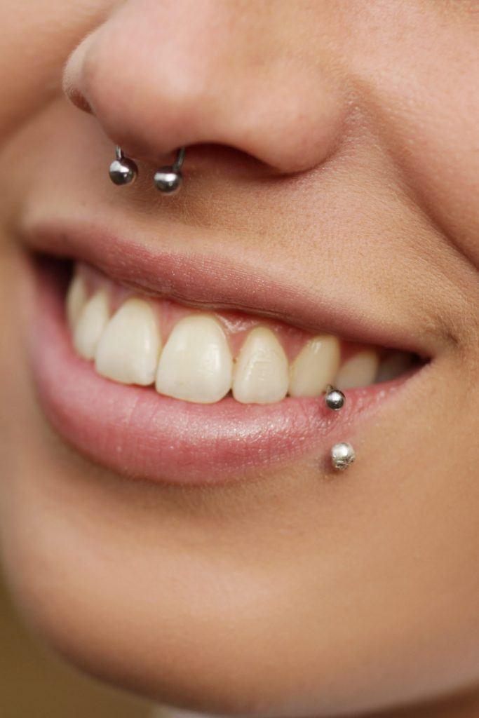 How is that ear to lip piercing called? : r/piercing