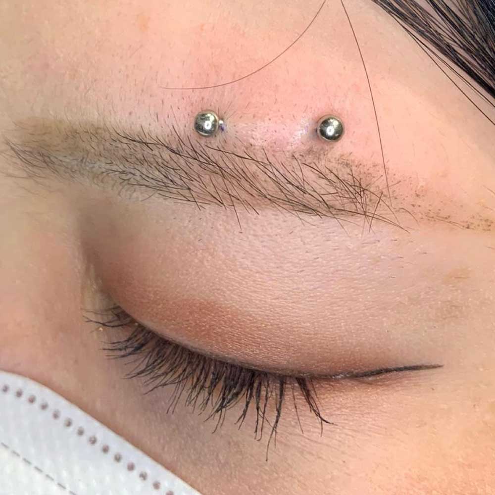 Horizontal eyebrow piercing