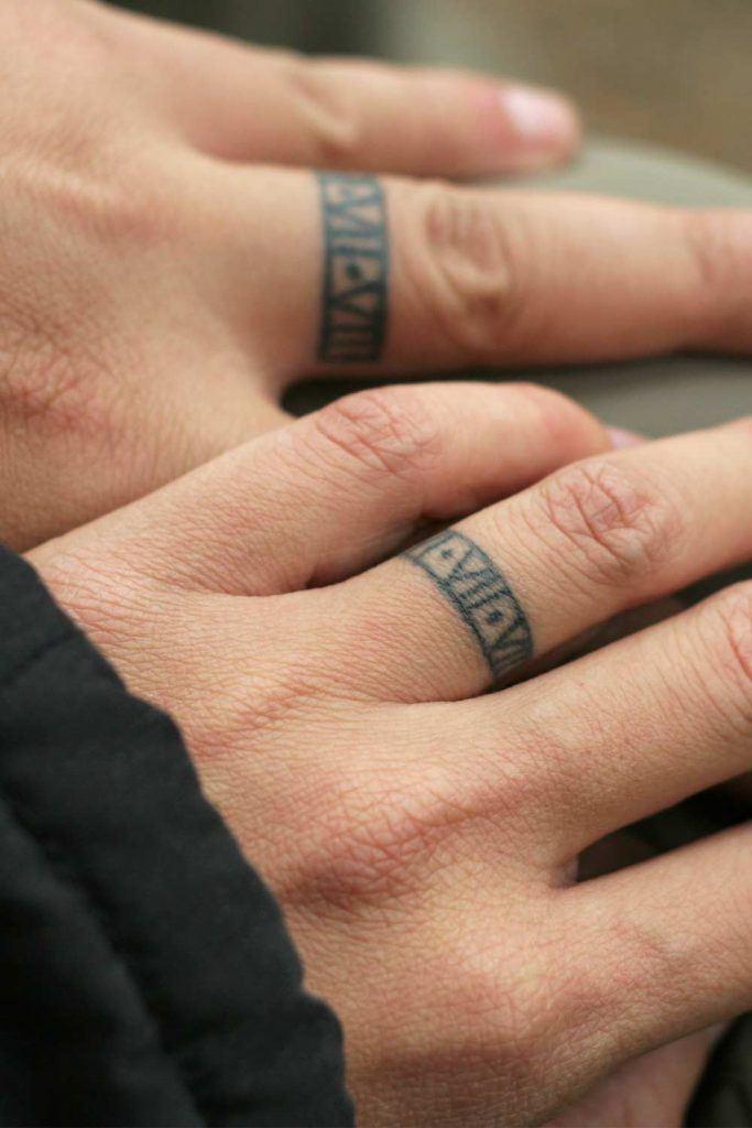 Ring Placed Couple Tattoos