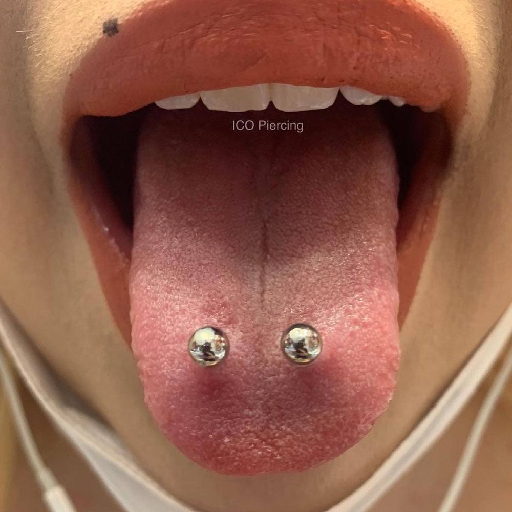Frog eye tongue piercing