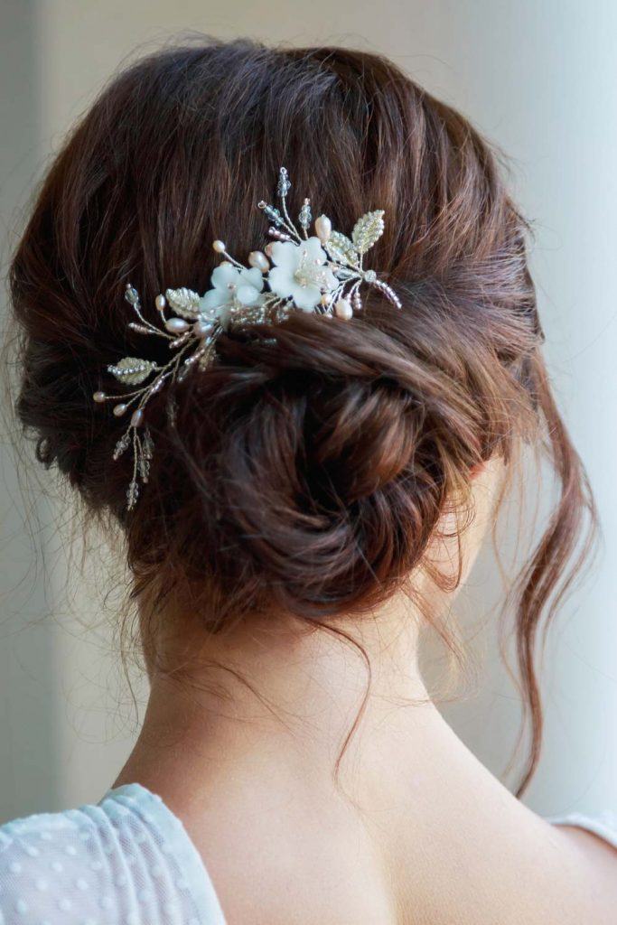 Updo Hairstyle with Floral Accessory