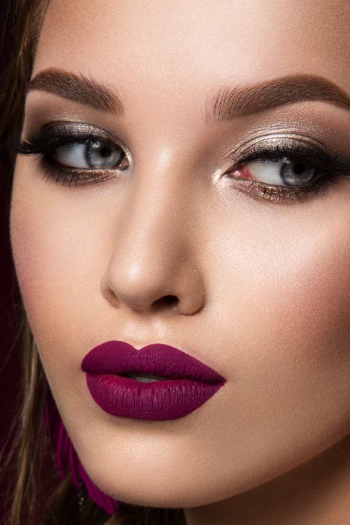 Bold Purple Lipstick For 90s Makeup Trend
