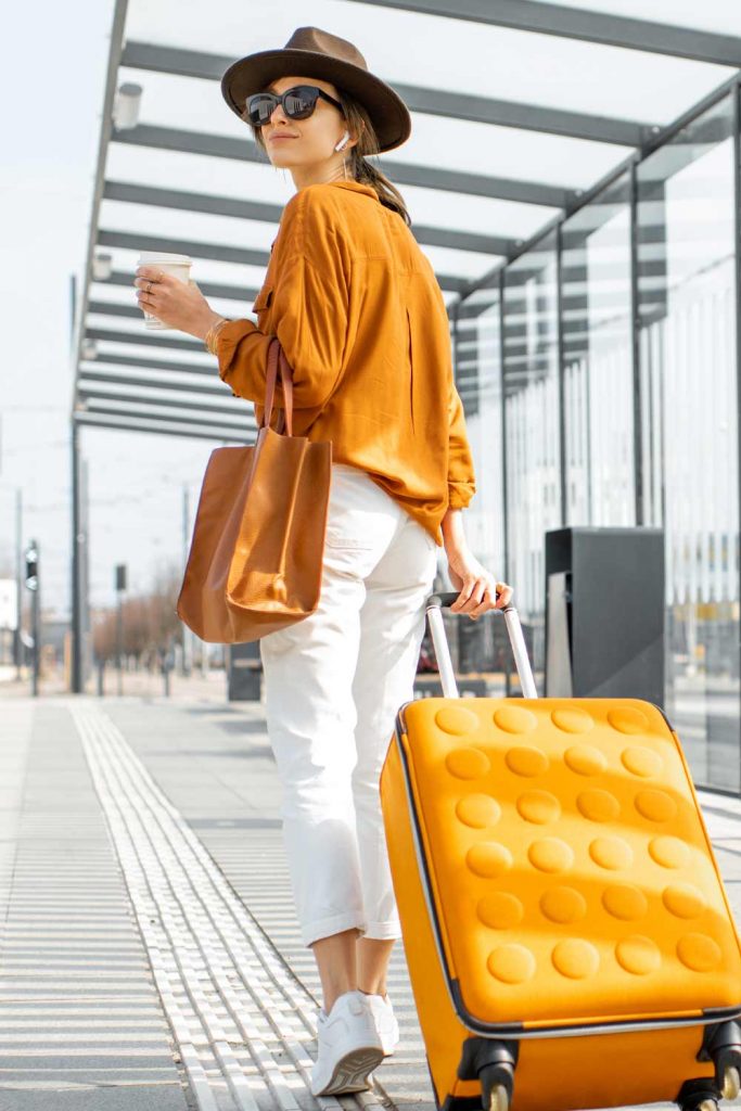 Casual Airplane Outfits with Bright Orange Shirt