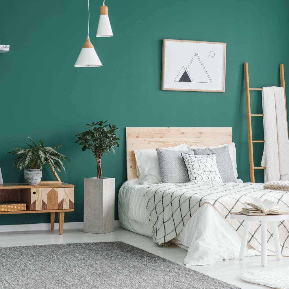 Green Accent Bedroom with Wall Pictures