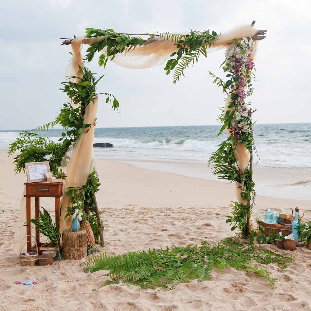 Beach Wedding Arch with Greenery and Flowers