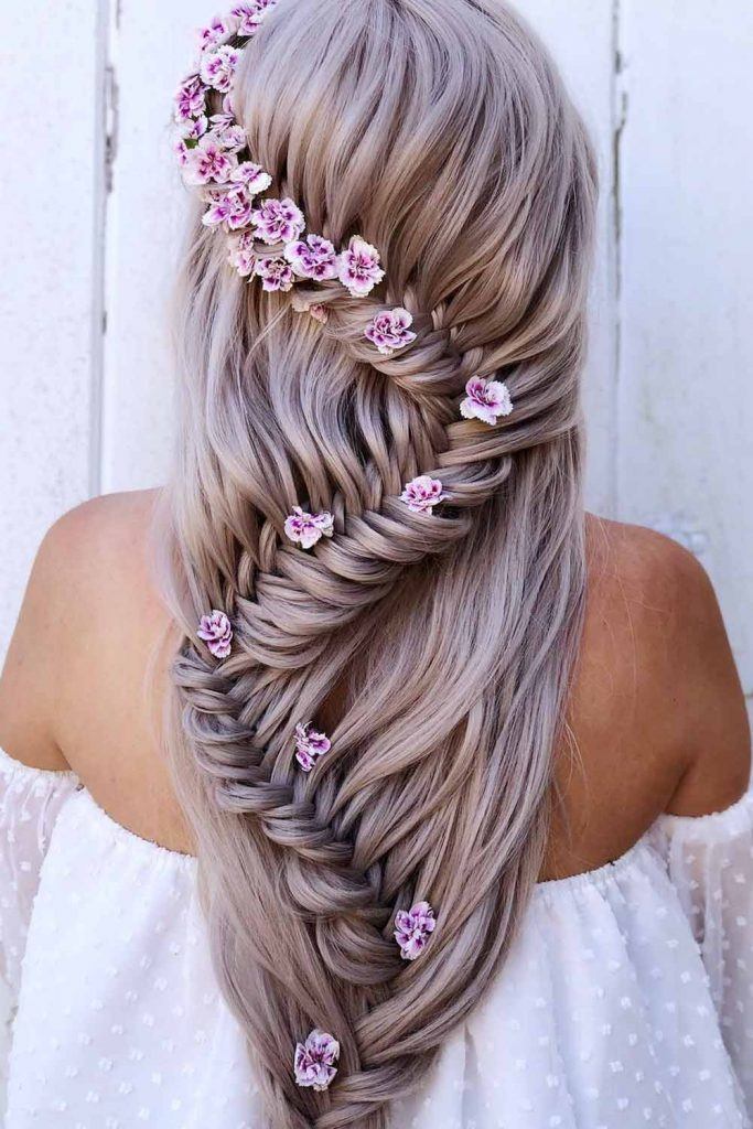Long Braid with Floral Accessory Hairstyle