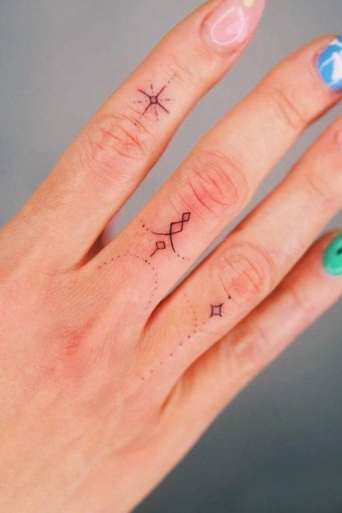 star tattoos on fingers