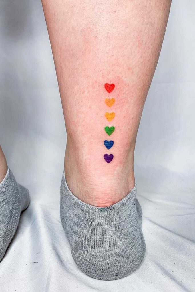 leg tattoos for women rainbow hearts