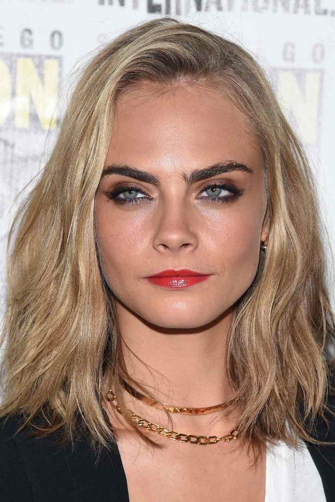 Cara Delevingne with Side Parted Layered Bob