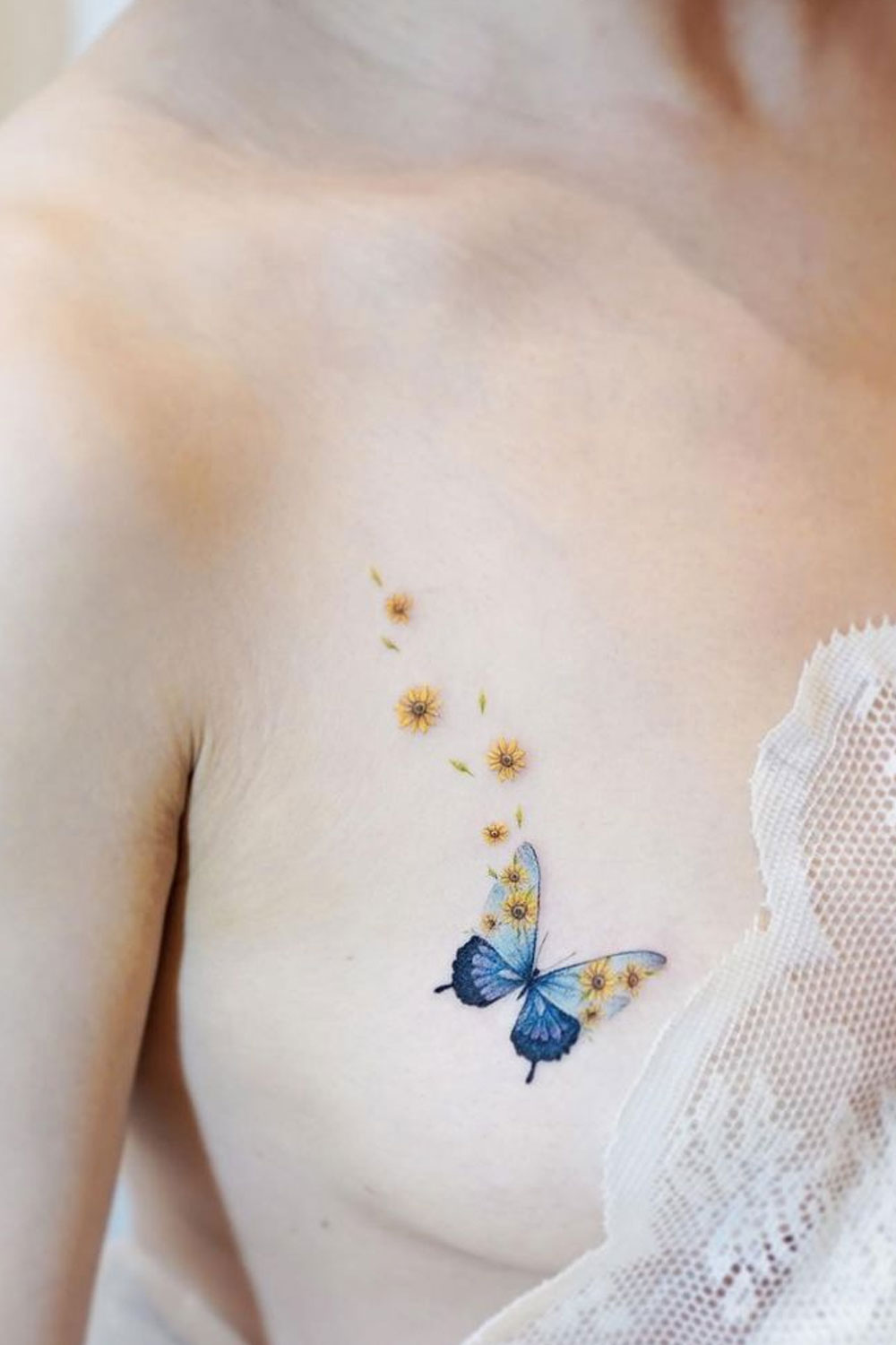 Floral Butterfly Tattoo on a Breast