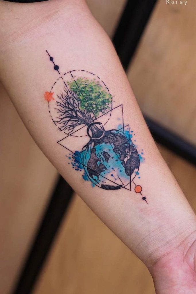 Forearm Tattoo with a Tree and Planet