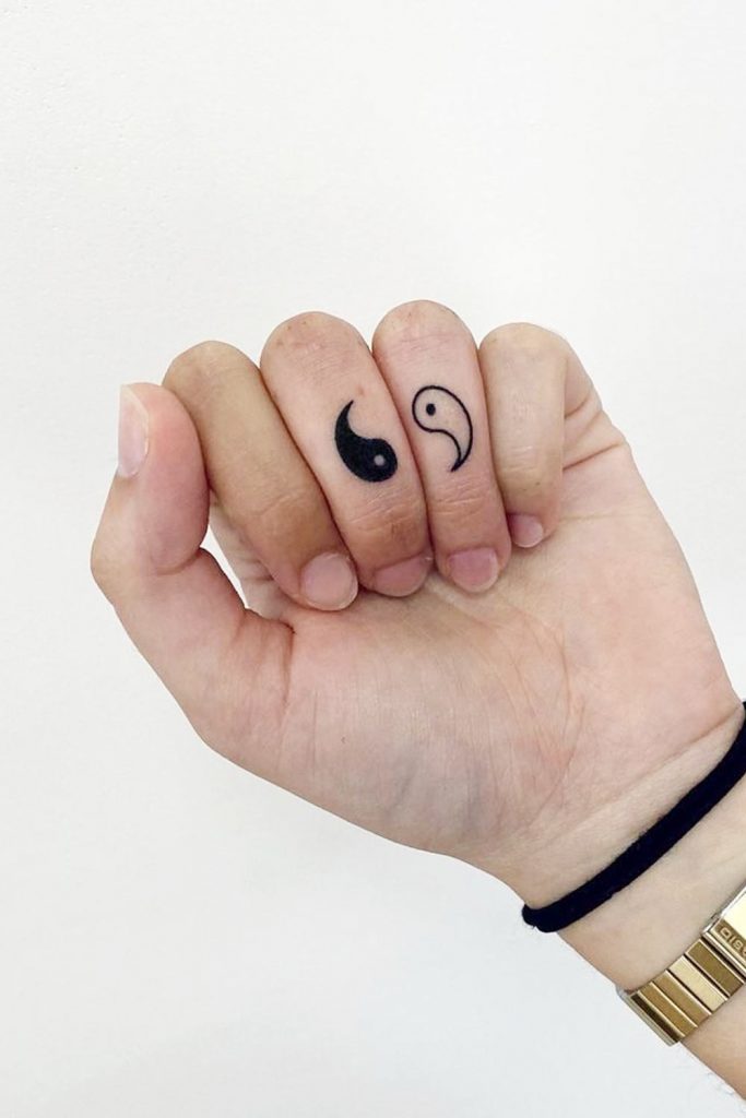 Yin and Yang Finger Tattoo