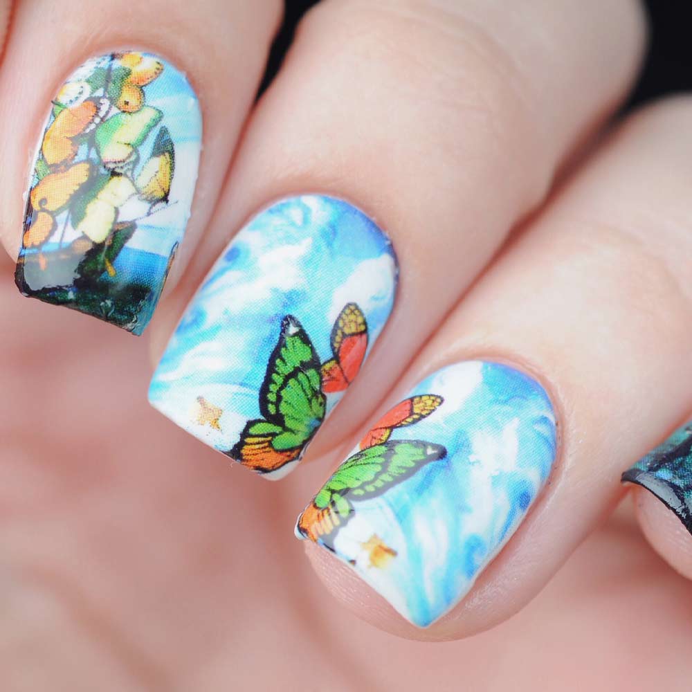 Blue Nails with Half Butterfly Art