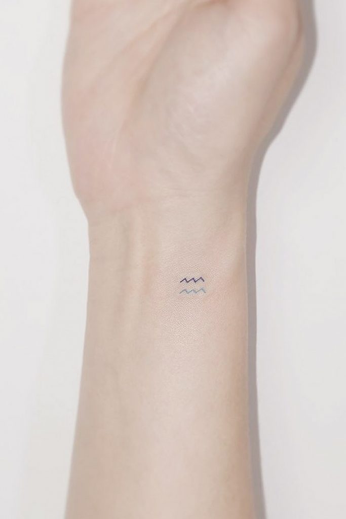 Minimalist Aquarius Sign Tattoo on Wrist