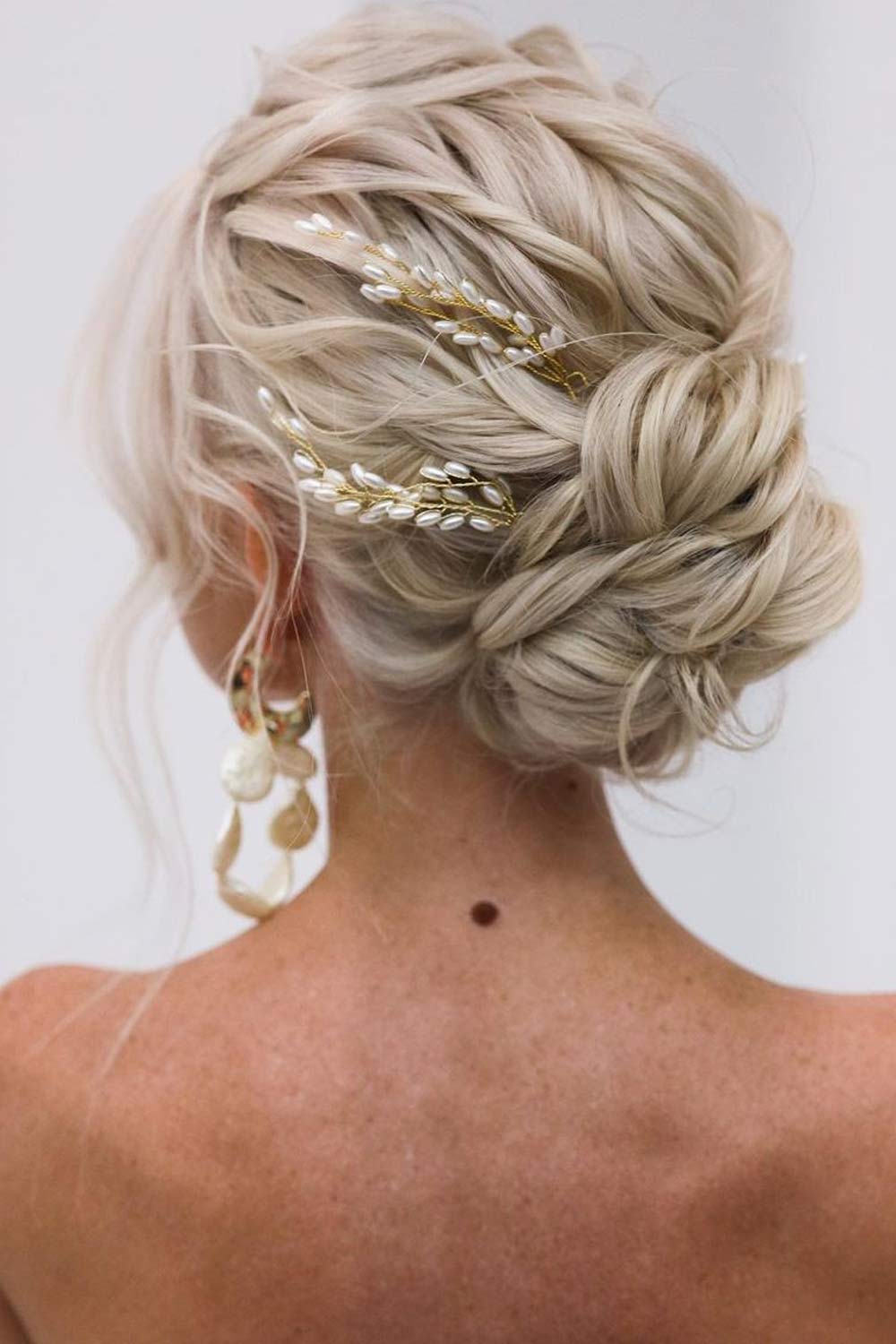 Voluminous Hair Updo with Accessory