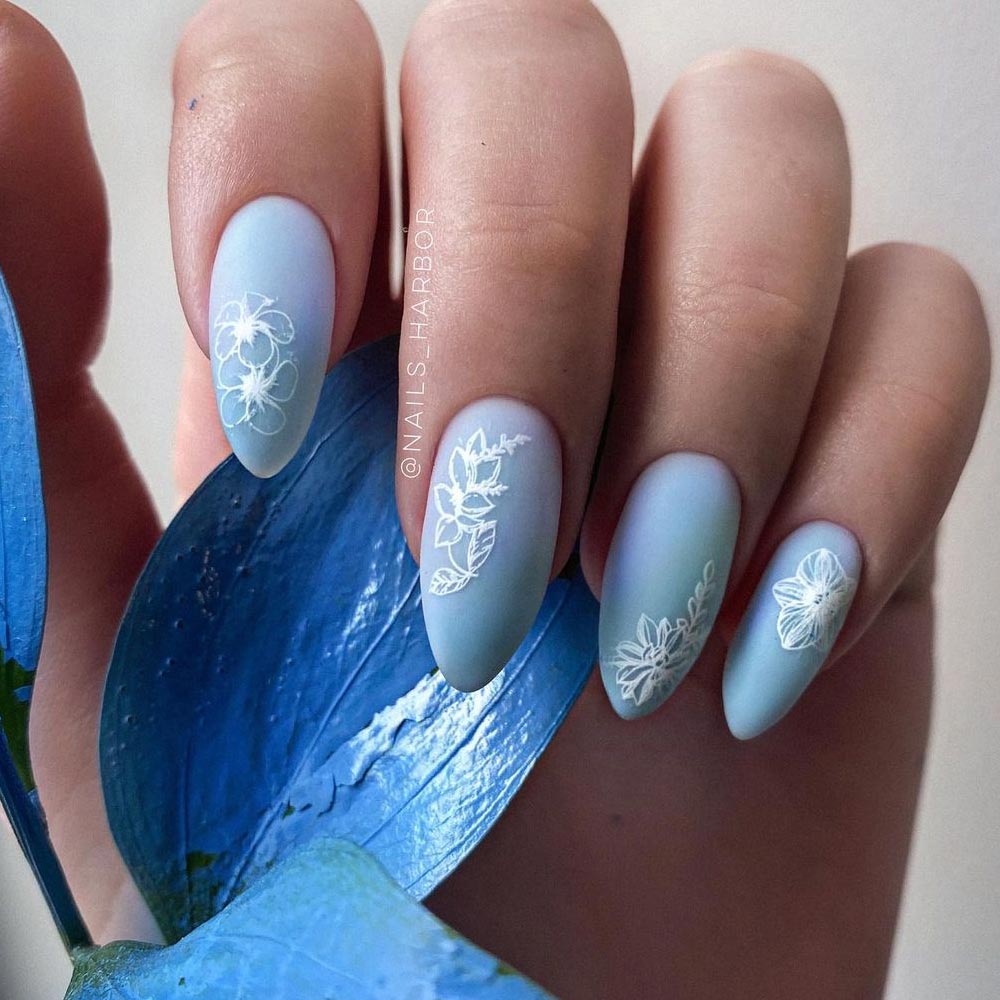 Pastel Blue Nails with Flowers