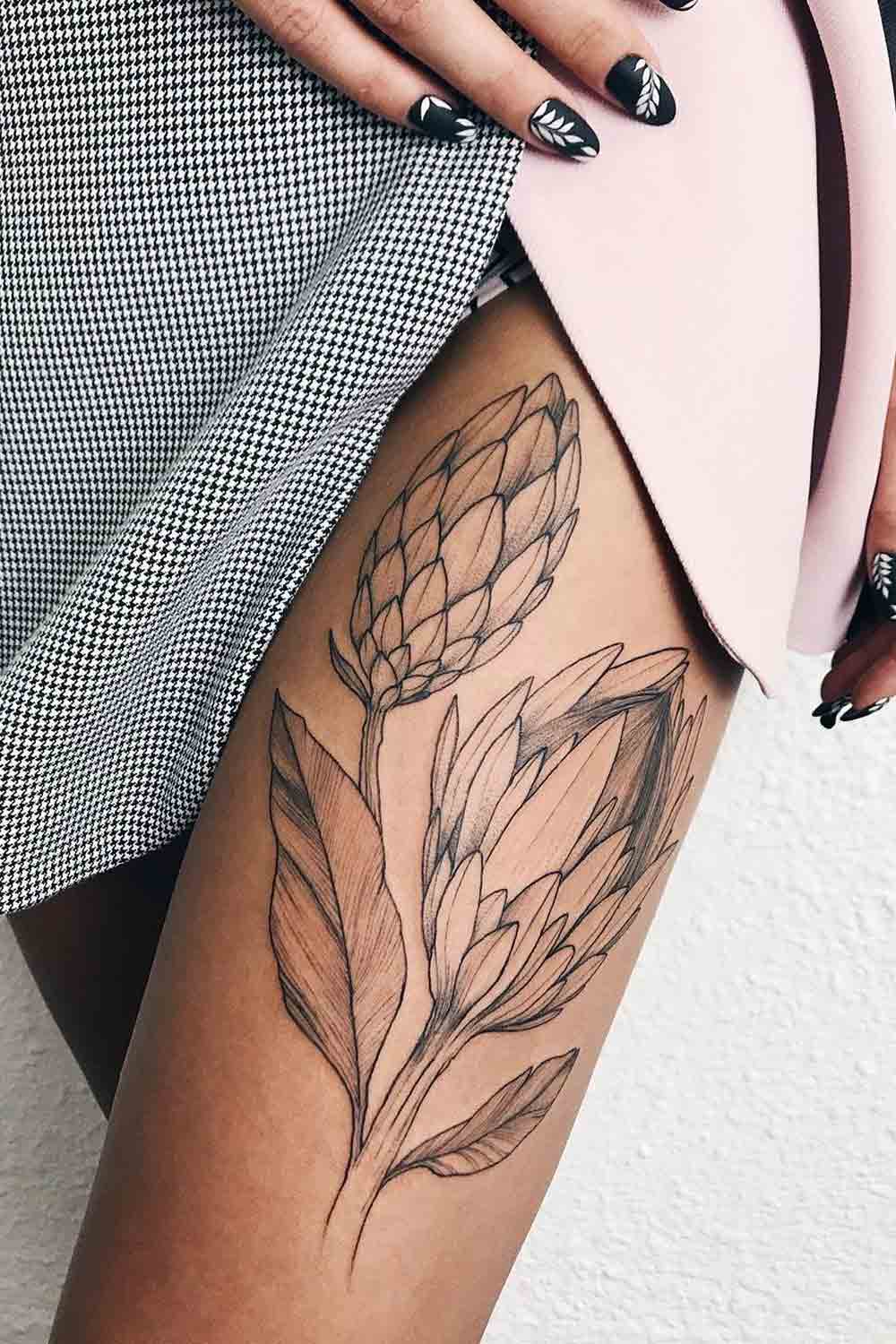 Big Black and White Thigh Tattoo with Flowers