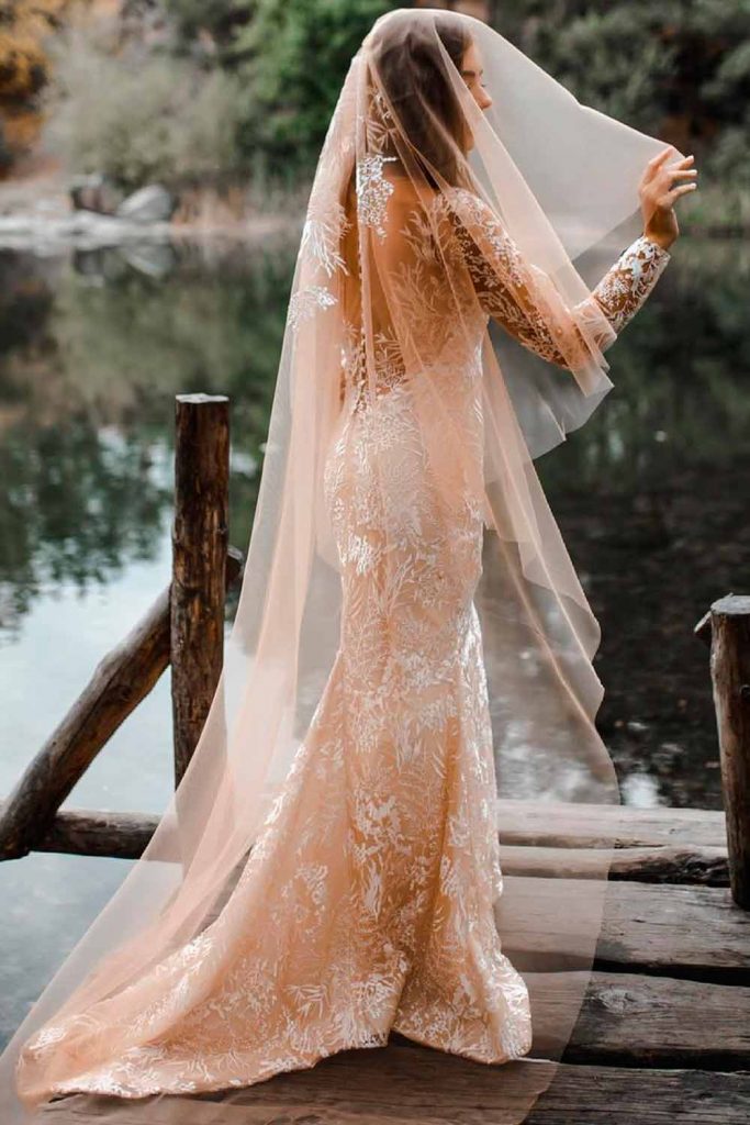 https://glaminati.com/wp-content/uploads/2022/12/wedding-veils-styles-beige-chapel-length-blusher-683x1024.jpg