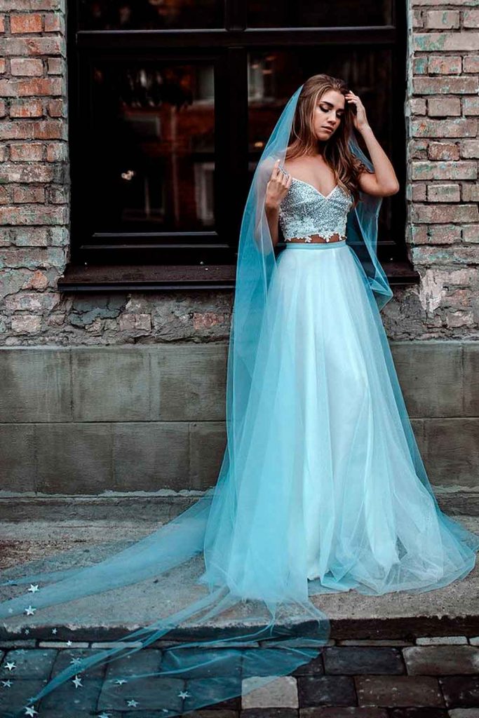 https://glaminati.com/wp-content/uploads/2022/12/wedding-veils-styles-cathedral-length-dusty-blue-glitter-stars-683x1024.jpg