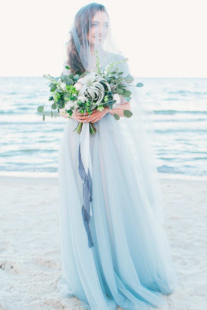 https://glaminati.com/wp-content/uploads/2022/12/wedding-veils-styles-grayish-blue-chapel-length-blusher-683x1024.jpg