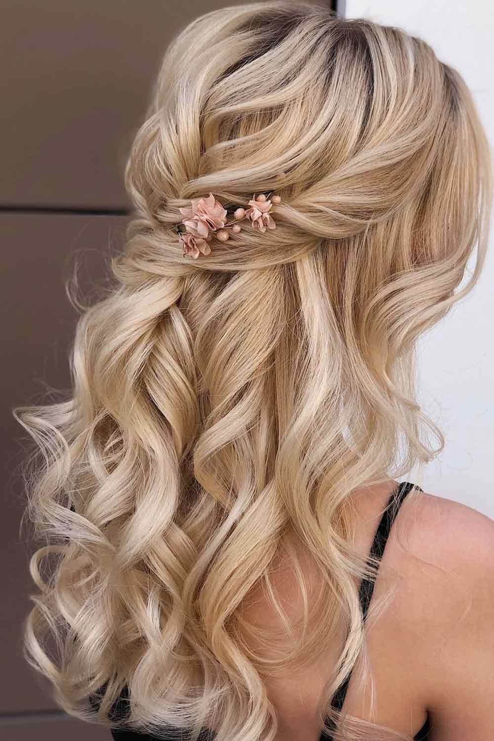 Wavy Half Up Half Down Hairstyle with Floral Accessory