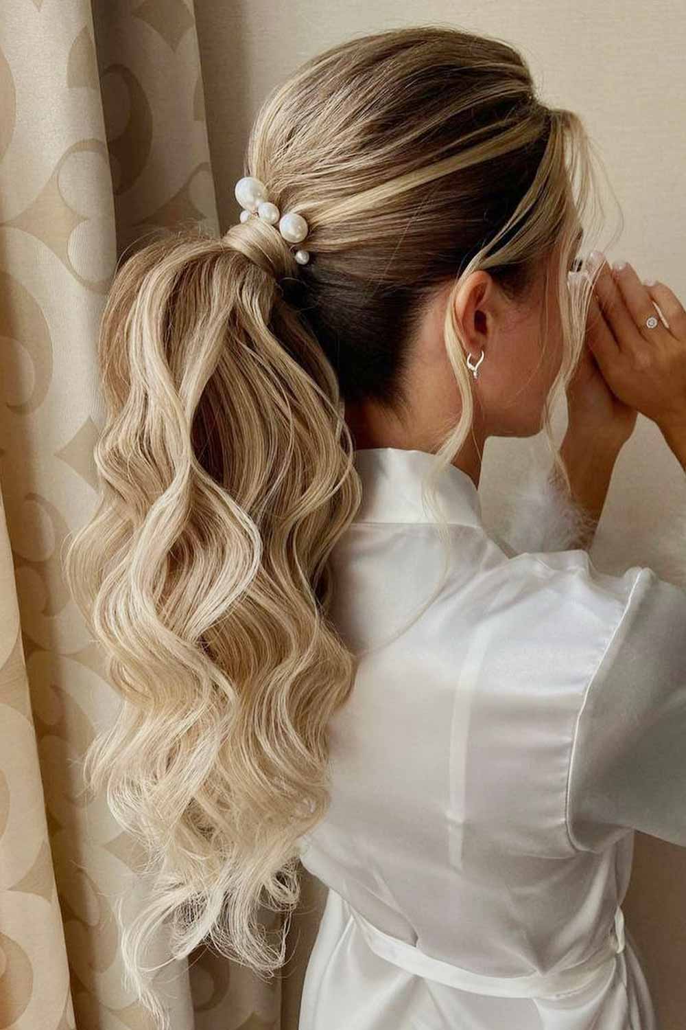 Voluminous Wavy Ponytail with Pearl Accessory